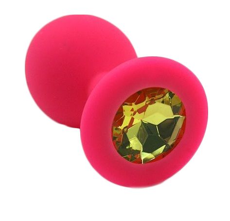 Анальная пробка из силикона розового цвета, размер M. Страз в основании круглой формы,  выполнен из стекла желтого цвета. Упакована в вельветовый мешочек для хранения. Вес - 46,5 граммов.