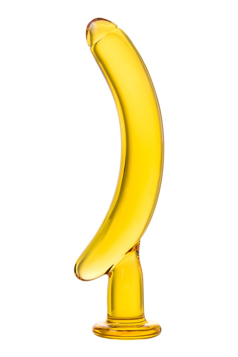 Ваша жизнь обязательно станет ярче и слаще, если вы решите использовать этот оригинальный стимулятор из жёлтого стекла. <br><br> Напоминая по форме банан на подставке, он обещает массу сильных ощущений при вагинальной или анальной стимуляции. <br><br> Благодаря изогнутой форме и гладкой, обеспечивающей идеальное скольжение поверхности, «банан» идеально подходит для массажа точки G у женщин и простаты у мужчин.  Рабочая длина - 13,5 см.
