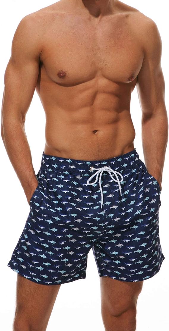 Темно-синие пляжные шорты с акулами. Отлично подходят для пляжного отдыха и плавания. С сеткой внутри. Быстросохнущая ткань.