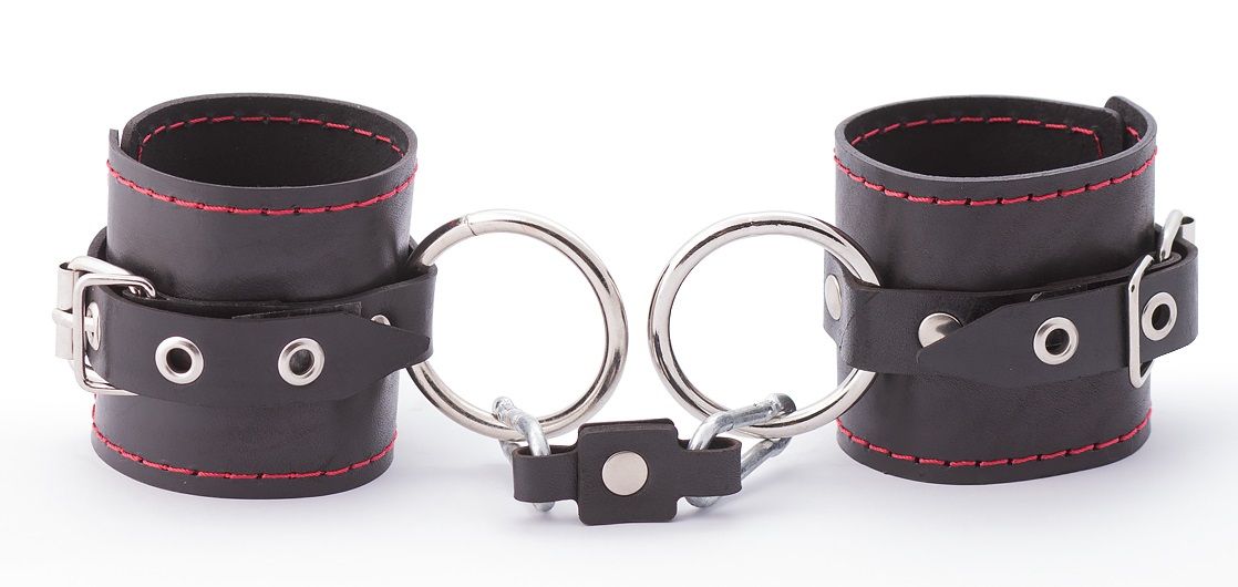 БДСМ-комплект: маленькая распорка и наручники. Выполнен из натуральной кожи. Длина распорки - 30 см.