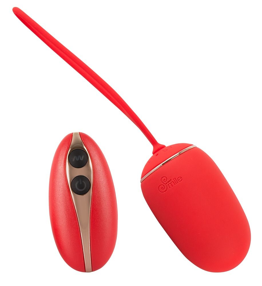 Красное виброяйцо Remote Controlled Love Ball с 7 режимами вибрации и пультом ДУ. Удобный шнурок для безопасного извлечения. Рабочая длина - 6,2 см.