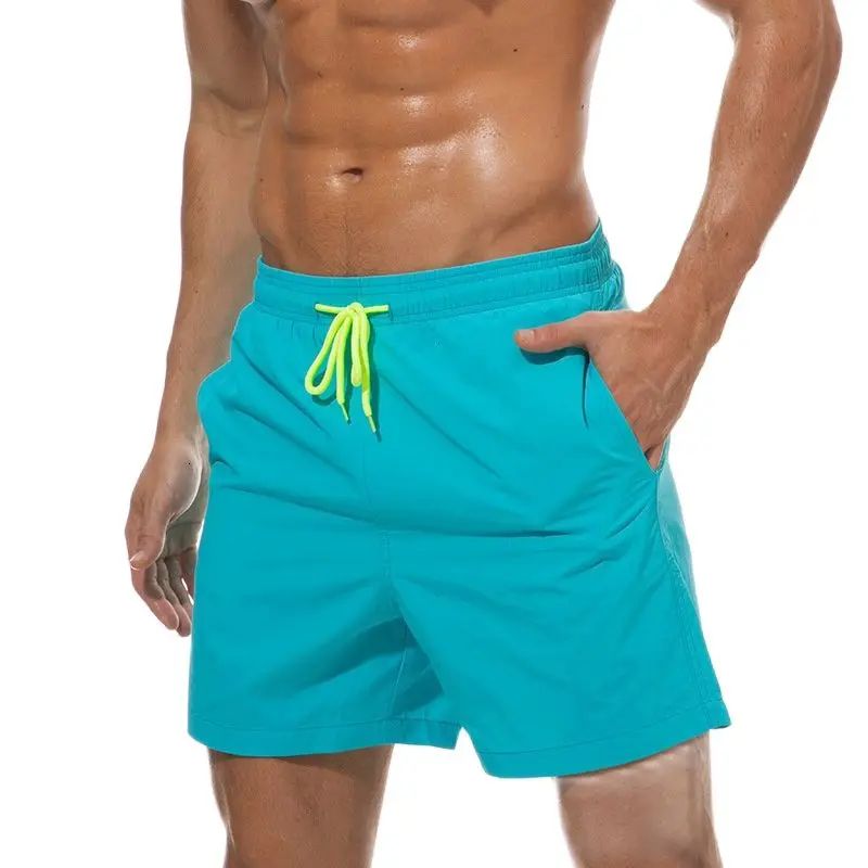 Бирюзовые мужские пляжные шорты. Отлично подходят для пляжного отдыха и плавания. С сеткой внутри. Быстросохнущая ткань.