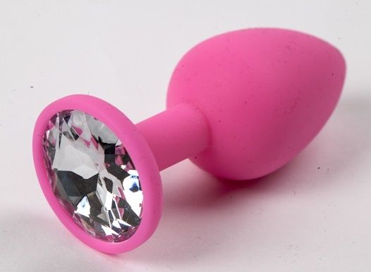 Розовая анальная пробка с прозрачным кристаллом. Широкое основание позволяет максимально безопасно использовать этот интимный аксессуар.