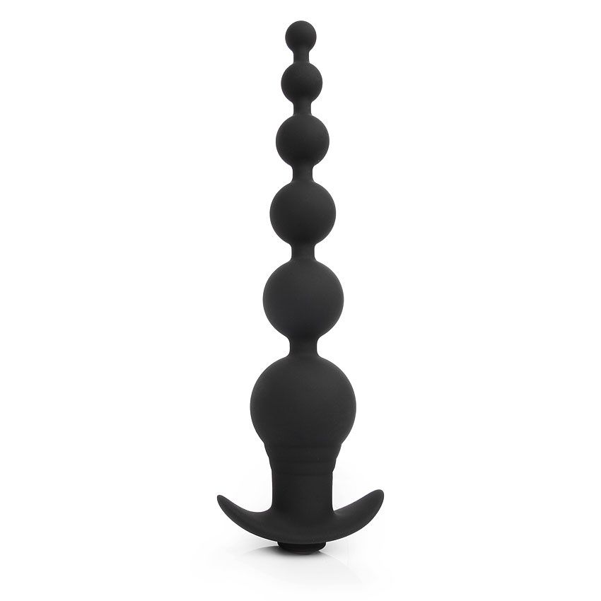 Черная анальная виброелочка TOWER. Выполнена из силикона, состоит из 6 шариков, имеет 9 режимов вибрации, управляемых при помощи пульта ДУ. Минимальный диаметр - 1,3 см.