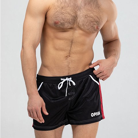 Мужские спортивные короткие шорты из быстросохнущего перфорированного двухслойного материала. Основной цвет оттенён яркими лампасами. Пояс на резинке дополнен регулирующим контрастным шнурком с брендированными металлическими эглетами. Удобные боковые карманы для мелочей. Контрастная отстрочка швов. Шорты имеют внутренние дополнительные сетчатые плавки для комфортного ношения. Эта модель отлично сидит и подходит не только для пляжа, плавания, но и активного занятия спортом.