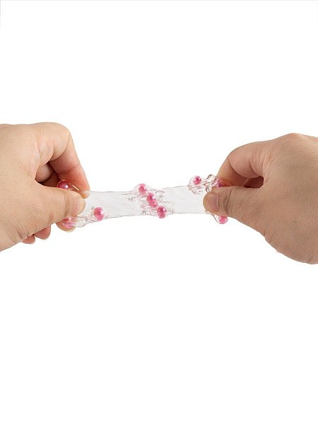 Сквозная насадка на пенис увеличит толщину полового члена мужчины и позволит его партнёрше испытать потрясающие эротические эмоции. Выпуклости с цветными шариками на поверхности изделия усилят возбуждение женщины. Интимный аксессуар изготовлен из эластичного материала. Хорошо мнётся и тянется. Подходит для пенисов разных размеров. Прост в применении и уходе. Внутренний диаметр - 2,5 см.